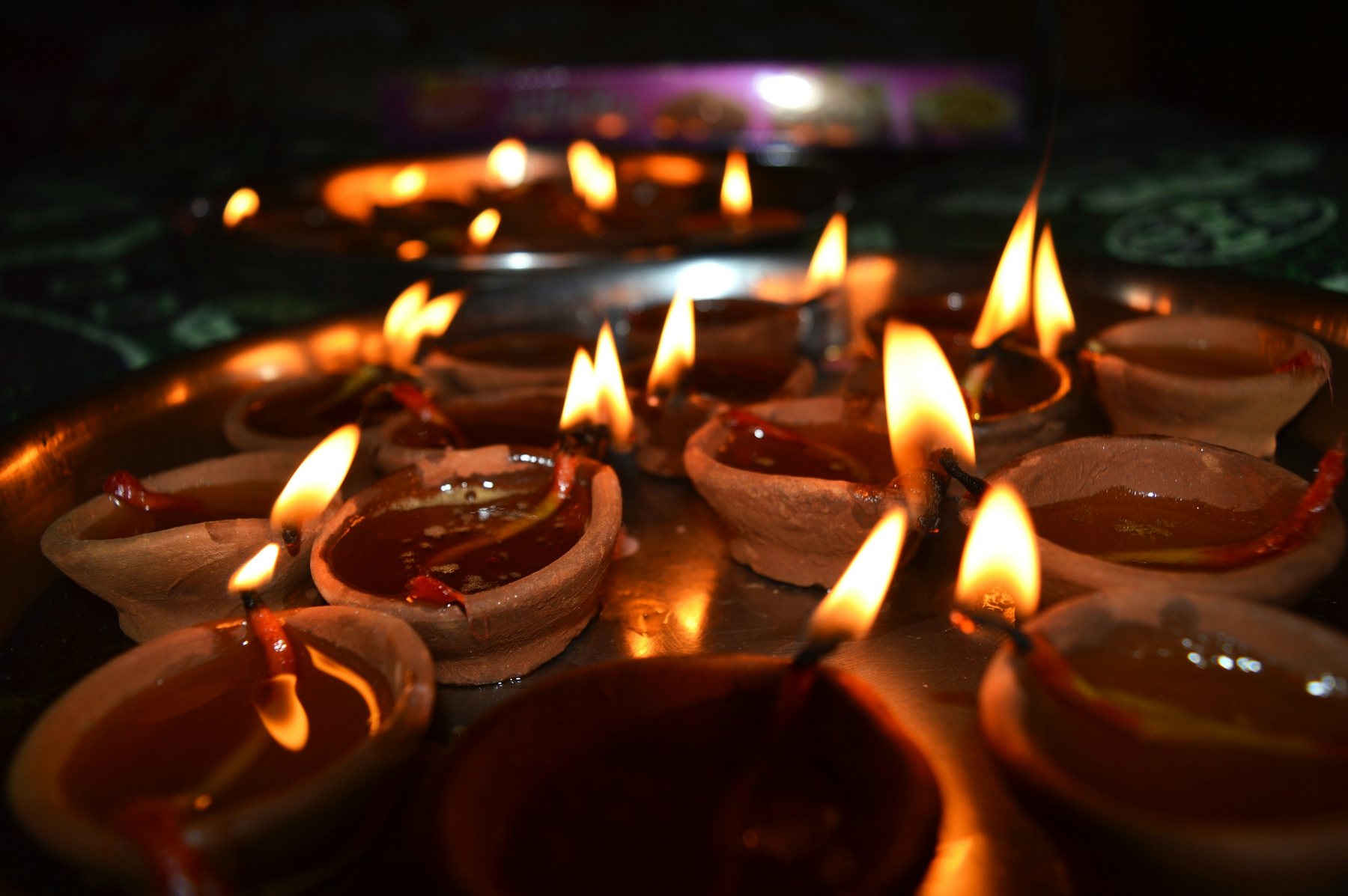 Clay oil lamps glowing during Diwali